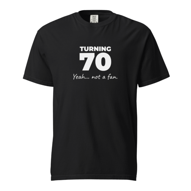Not A Fan Brand - A black T-shirt with white text that reads “TURNING 70 Yeah... not a fan.”.